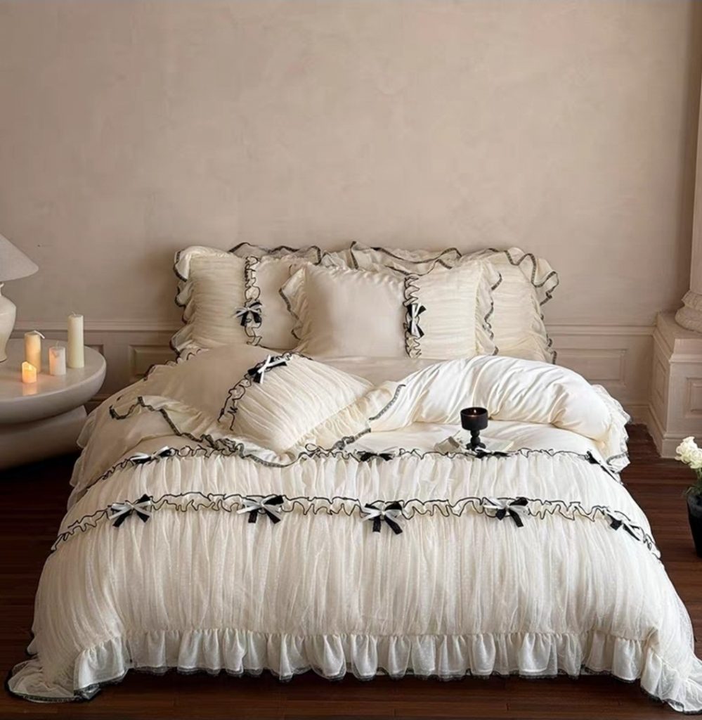Romantic designer-style cream bedding with black ribbon details from Verlin Studio