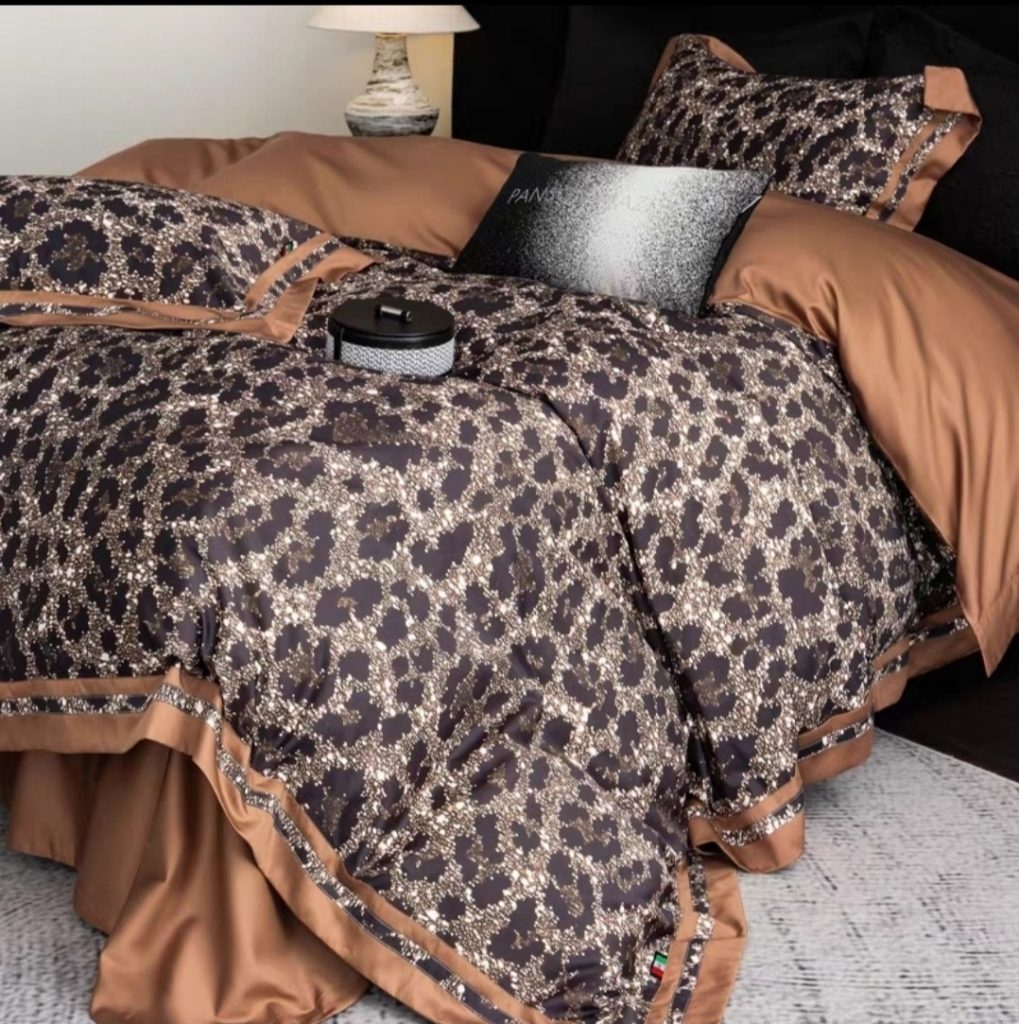 Leopard print bedding with burnt orange accents from Verlin Studio

